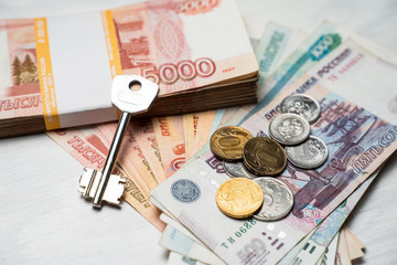 the key lies next to the bundles of Russian rubles
