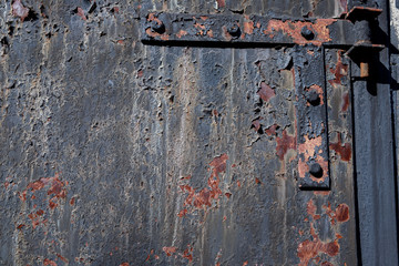 Grunge rusty metal texture. Corrosion of iron with streaks of rust. Selective focus.