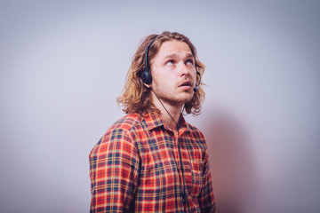 Portrait of a handsome customer service operator wearing a headset