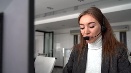 Female customer support operator with headset and smile