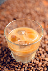 White russian cocktail with ice and cream liquor. Selective focus. Shallow depth of field.