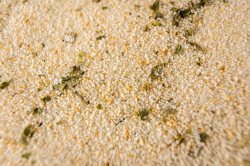 Breadcrumb powder with parsley photographed with macro photography