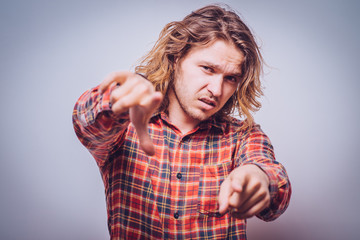 You suck. Portrait unhappy, angry, mad, executive man, annoyed, giving showing thumb down gesture...