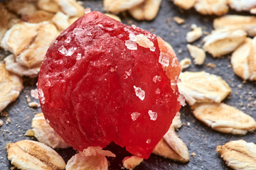 oatmeal are on the table with dried cherry.