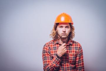 builder with magnifying glass