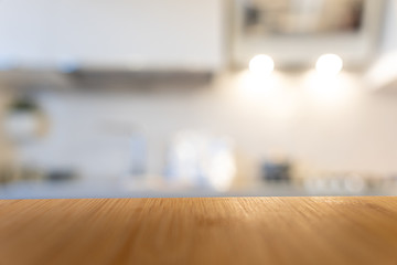Wooden table top on blur kitchen room background. For displaying the assembly product or visual arrangement of the configuration keys