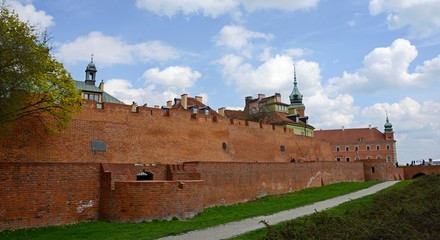 Warsaw Old city. Houses and city wall. Earthworks. Red brick city wall. Small street, Rycerska street, in the medieval old city in Warsaw. The oldest historical district of Warsaw