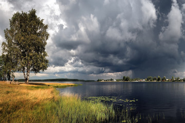 A thunderstorm is approaching, nature froze in anticipation of a storm of swirling, swirling clouds of rain.