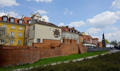 Warsaw Old city. Houses and city wall. Earthworks. Red brick city wall. Small street, Rycerska street, in the medieval old city in Warsaw. The oldest historical district of Warsaw