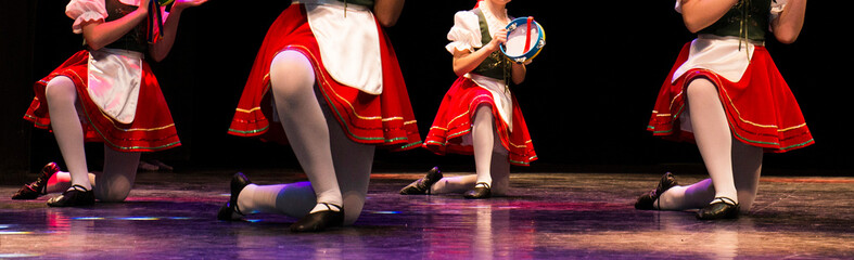 Girls dancing on stage folk dances
