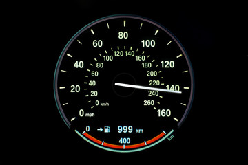 230 Kilometers per hour,light with car mileage with black background,number of speed,Odometer of car.	
