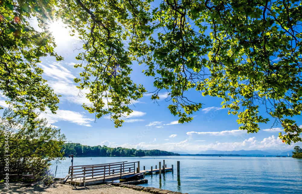 Wall mural old wooden jetty at a lake