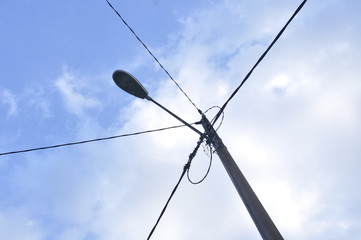 electric pole against blue sky