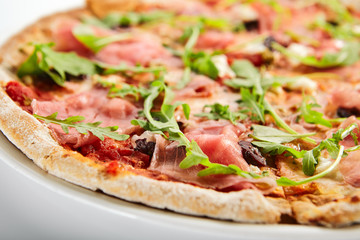 Pizza with parma ham and artichoke