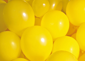 Group of yellow balloons create a background