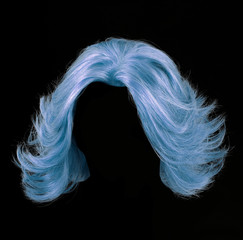 Blue hair wig isolated on black background