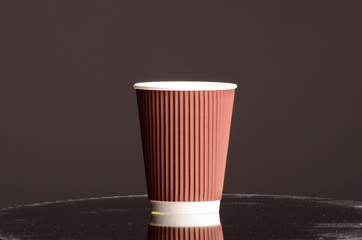 Paper coffee cup in coffee shop.