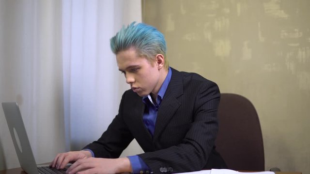 Tired office worker rubs his eyes, hard monogamic work in office, paper wokr