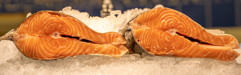 chilled fish fillets in ice in a shop. salmon