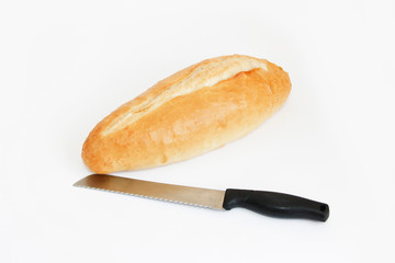 baguette bread and knife for cutting on a white background