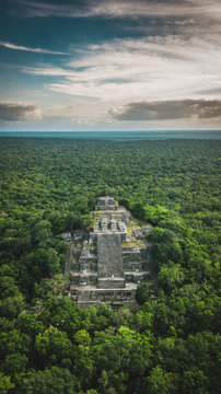 Aerial view of the pyramid, Calakmul, Campeche, Mexico. Ruins of the ancient Mayan city of Calakmul surrounded by the jungle