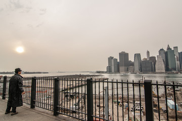 Lonely man looking at the Manhattan Financial District