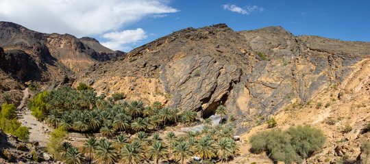 Mountain and valley view along Wadi Sahtan road in Al Hajir mountains between Nizwa and Mascat in Oman