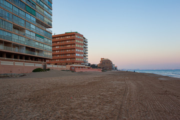 buildings on the Mediterranean beachfront at sunset