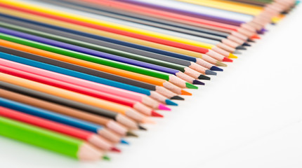 colored pencils lying in row