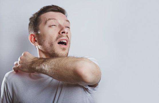 Man sneezes elbow