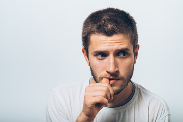 man bites his nails