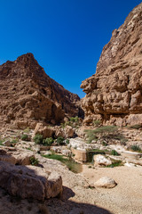 Hike through narrow valley of Wadi Shab in Tiwi near Mascat in Oman