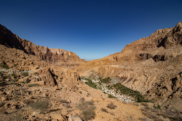 Fototapeta na wymiar Inside the narrow canyon of Wadi Tiwi at Shab near Mascat in Oman