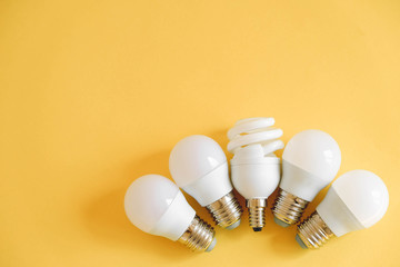 LED light bulbs on yellow background. Top view. Copy, empty space for text