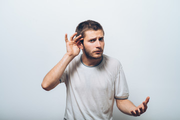 Overhears a man, tries to listen.