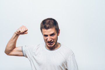 Fototapeta premium man showing her muscles