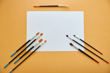 paper and pen on wooden background