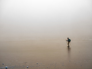 person ice skating in dense fog