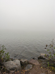 view of empty lake in dense fog
