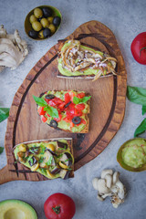Bruschetta on a dark background, Assorted bruschetta, Top view, Italian toasted crusty ciabatta bread