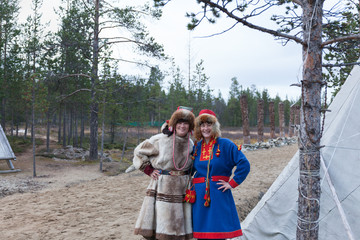 two female saami, sami in national dress, saami village on the Kola Peninsula, Russia.