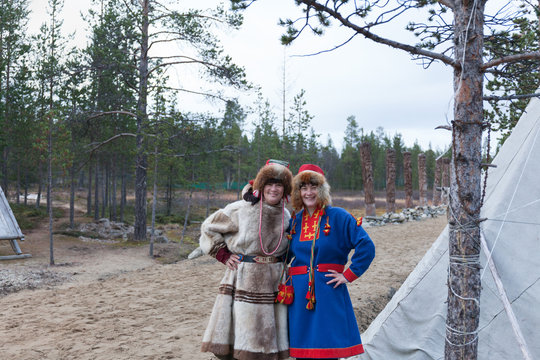 Two Female Saami, Sami In National Dress, Saami Village On The Kola Peninsula, Russia.