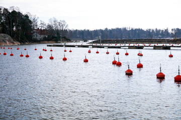 Red buoys in the sea.