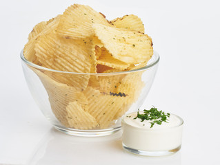 chips in transparent plate with white sauce