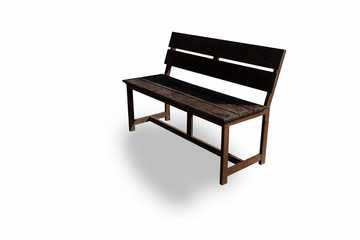 Vintage long wooden chairs for relaxing in the public garden. Under the trees and the beach