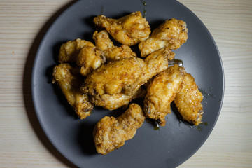 A plate of chicken with soy sauce glaze.
