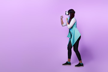 Woman is using virtual reality headset.