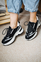 pair of black shoes on woman