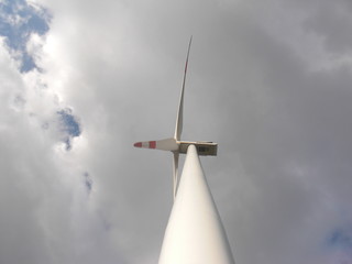 Wind turbine in a cloudy sky