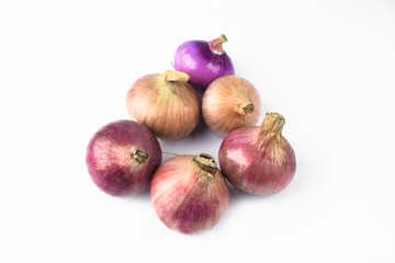 Portrait of six medium size fresh and ripe red onion isolated on a white background